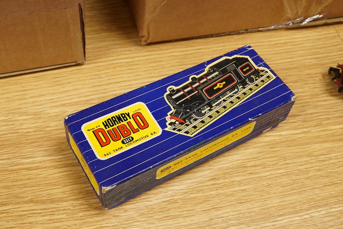 A collection of Hornby Dublo railway for 3-rail running, including three boxed locomotives; an LNER class A4 4-6-2 tender locomotive, Sir Nigel Gresley 7 (EDL1), a BR Duchess of Montrose 46232 (EDL12), and a BR class N2